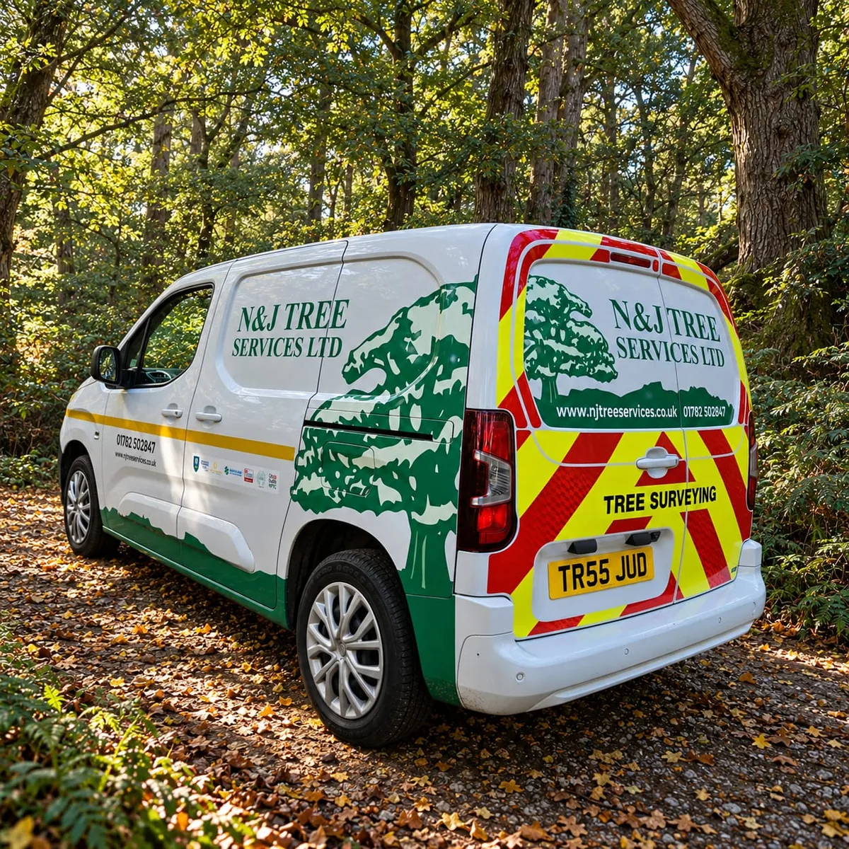 Branded N&J Tree Services tree surveying van parked in woodland